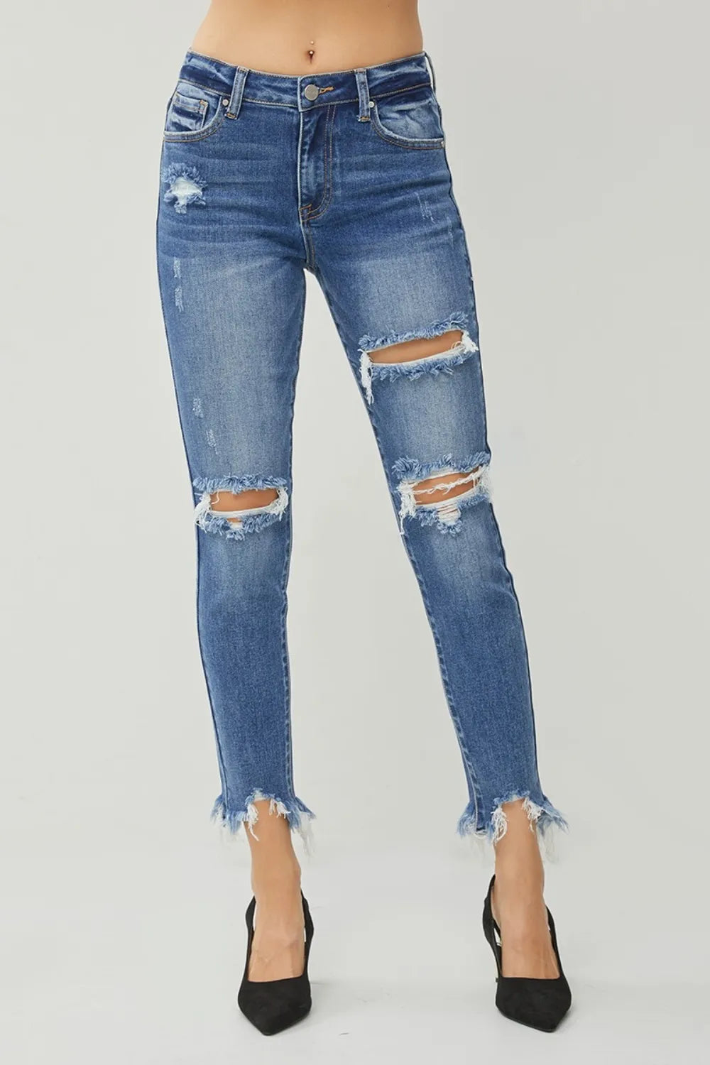 Women's distressed slim jeans with frayed hem front view