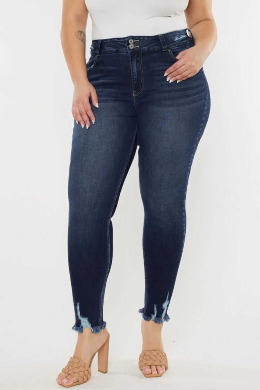 Women's high waist jeans with cat's whiskers and raw hem front view